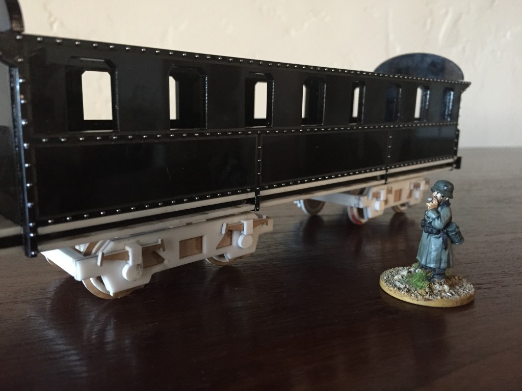 Personenwagon with rivets and trucks.